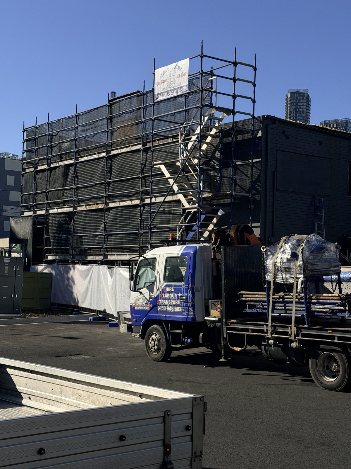 Access scaffold and protective sheeting on a Mounty County Scaffold project, view 2